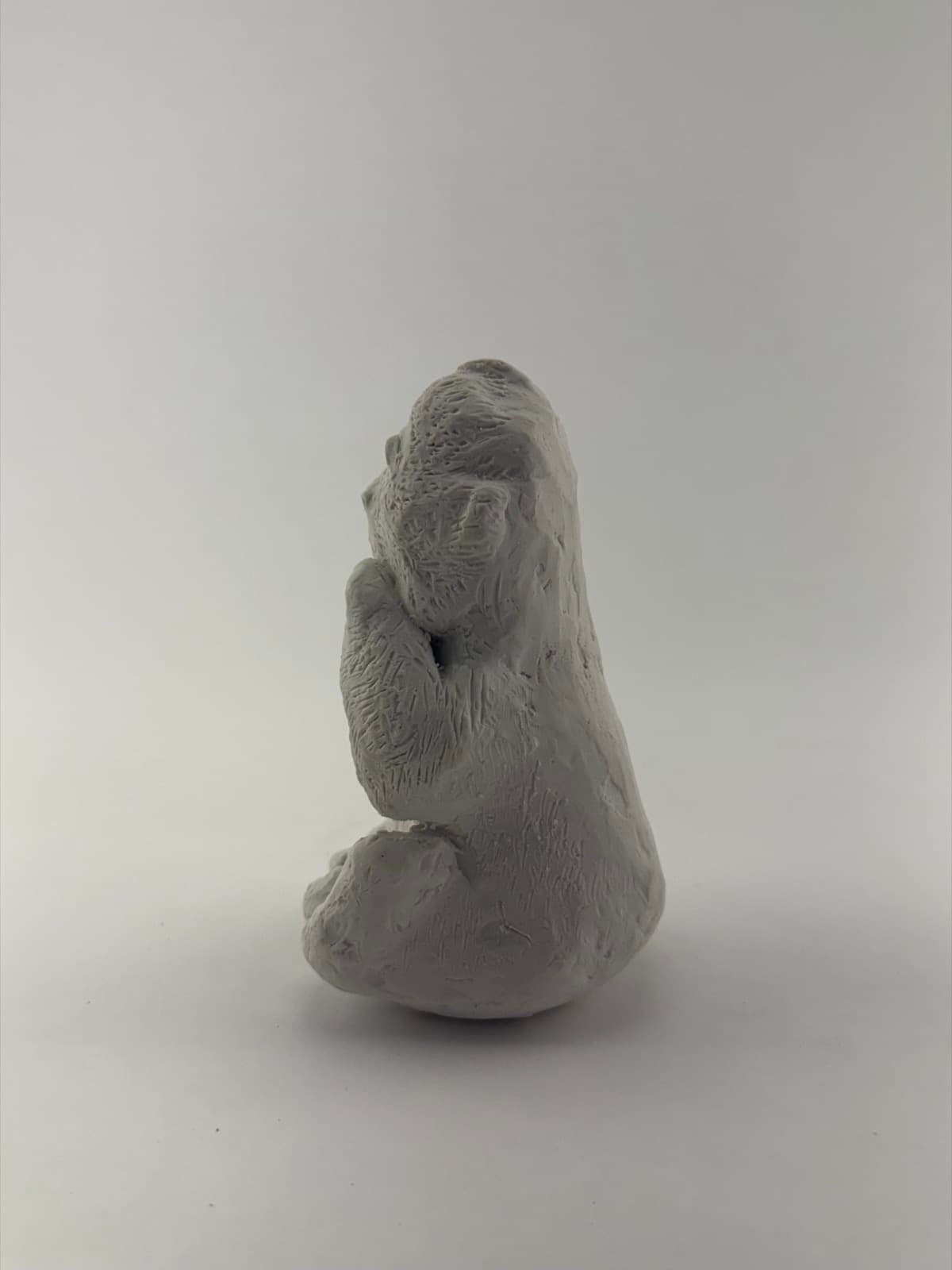 Side view of the hand-sculpted monkey sculpture