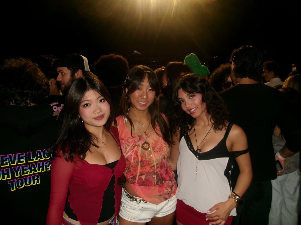Alayna with friends at a concert at night
