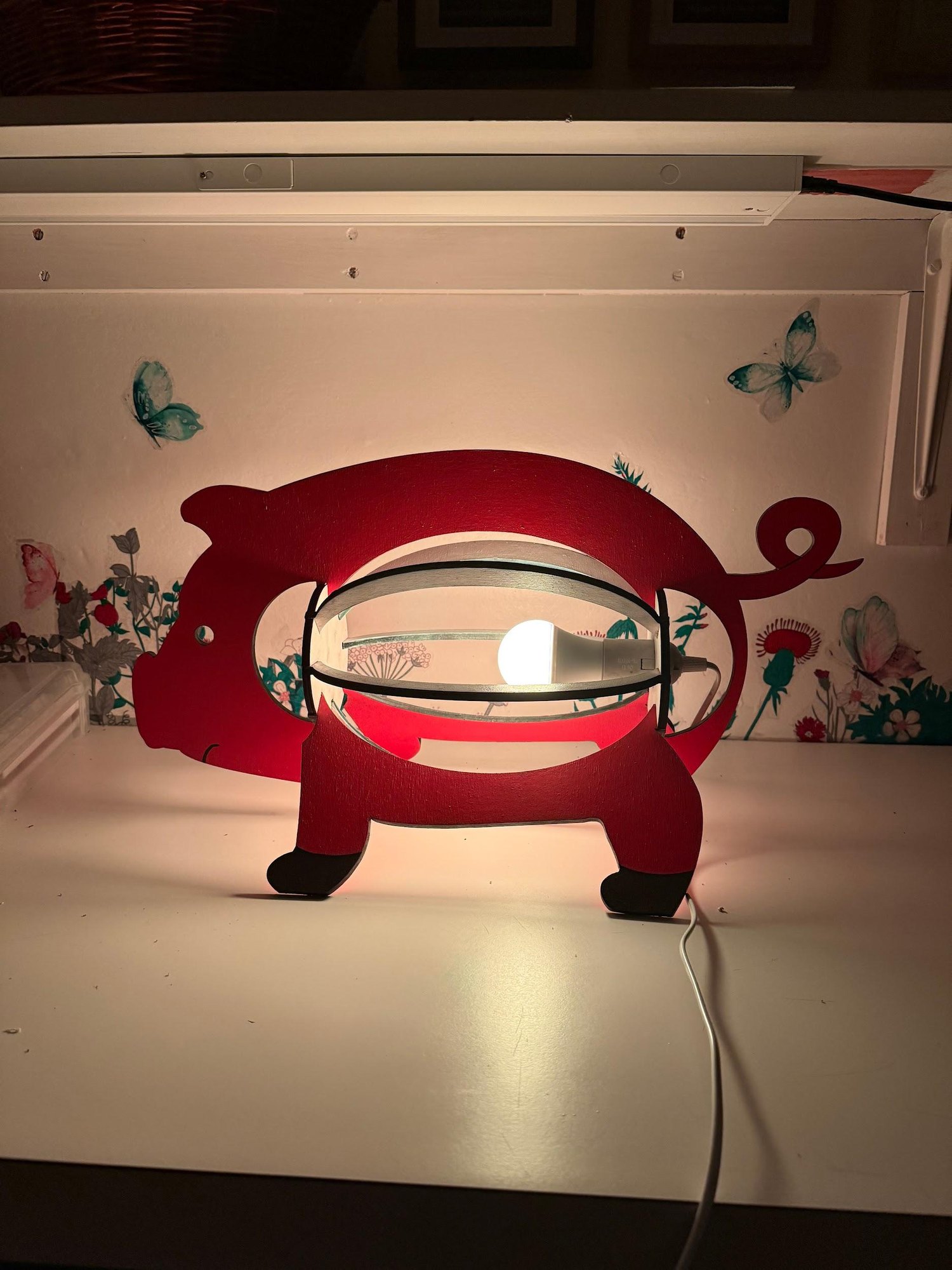 The finished lamp switched on in low light, glowing through its ribs.